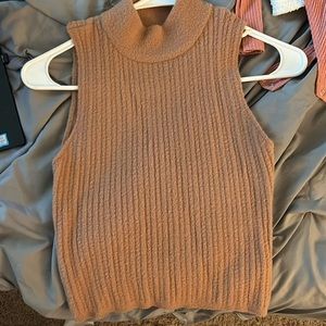 Soft, sleeveless turtleneck sweater